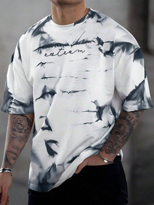 Abstract tie-dye oversized men's t-shirt in white with black print and embroidered text.