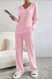 Blush pink ribbed V-neck loungewear set with wide-leg pants.