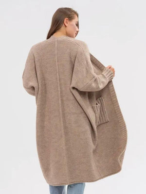 Oversized khaki acrylic knit cocoon cardigan with pockets and ribbed cuffs.