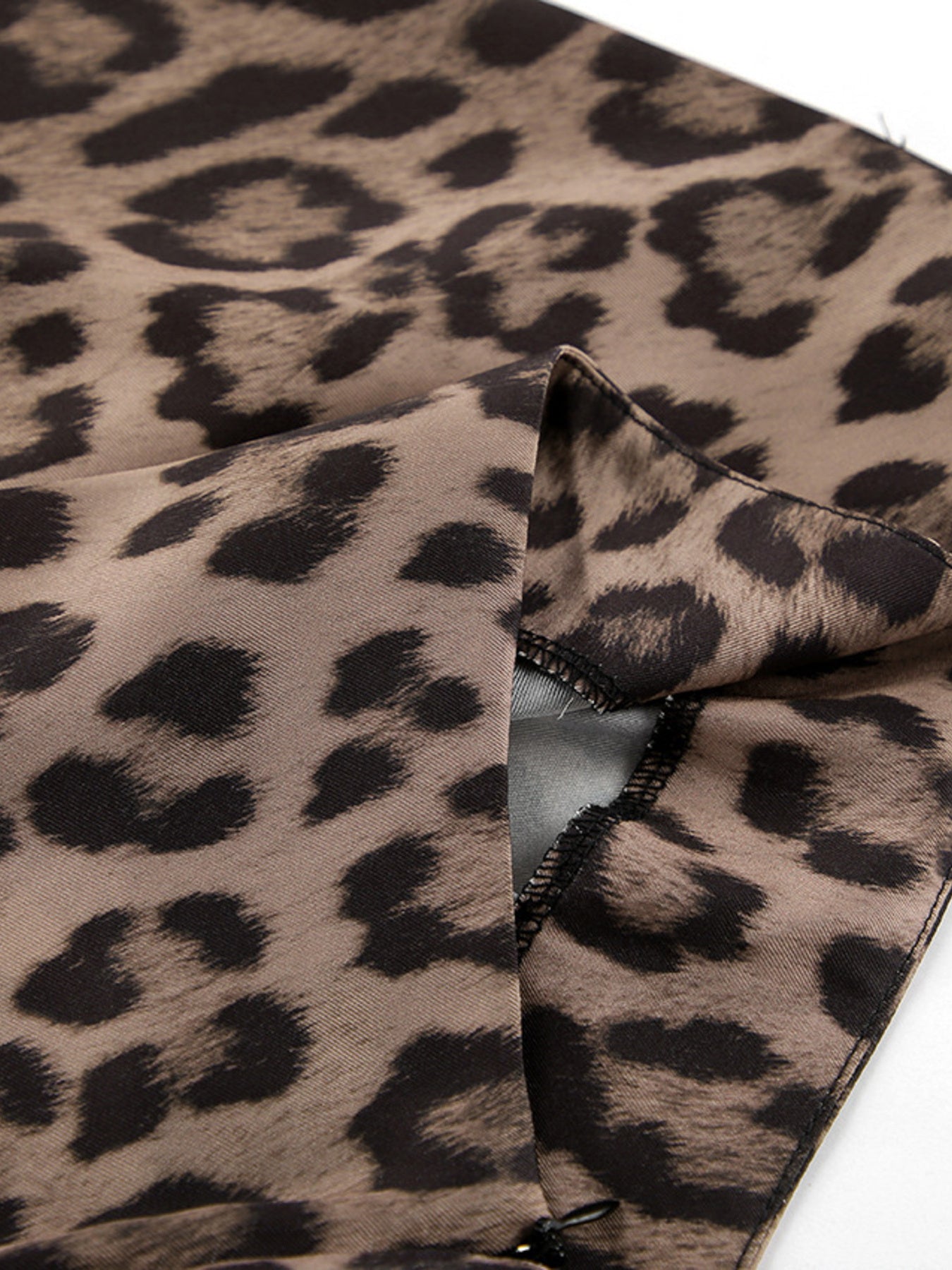 Flowy leopard print maxi skirt with a brown and black animal print pattern.