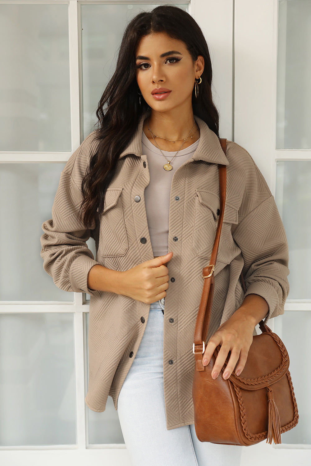 Khaki textured overshirt with patch pockets and button front, styled casually.