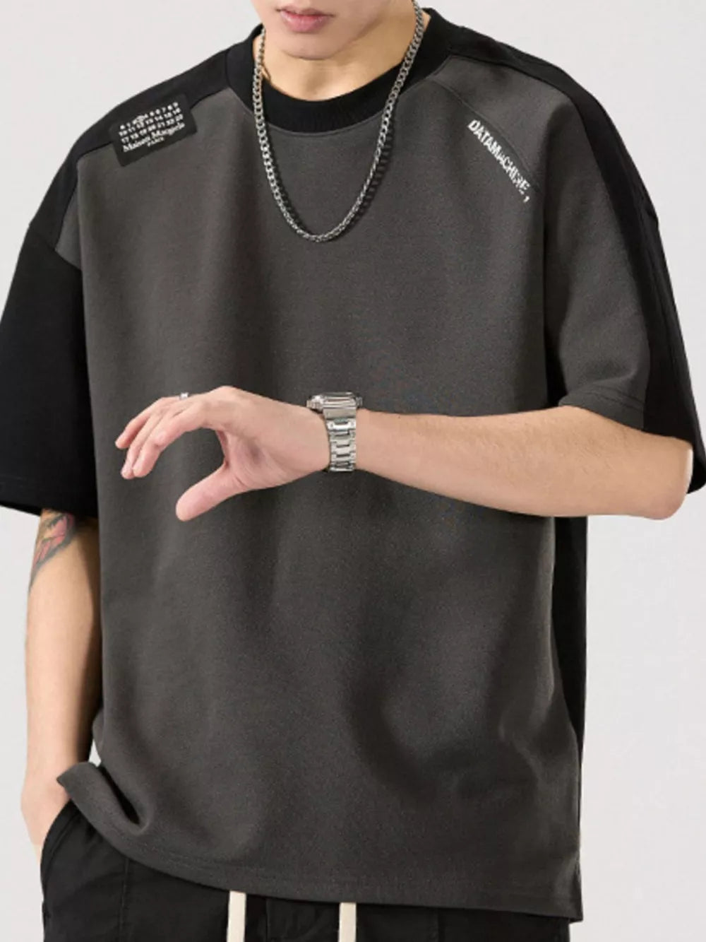 Color block t-shirt in gray and black cotton blend with round neck and short sleeves.