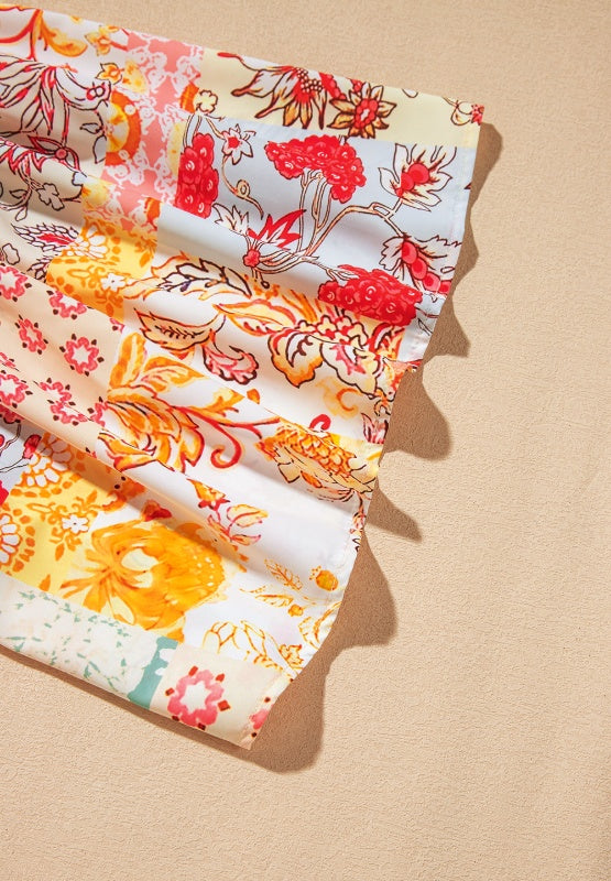 Patchwork sleeve t-shirt in beige with a floral print and ruffled hem detail.