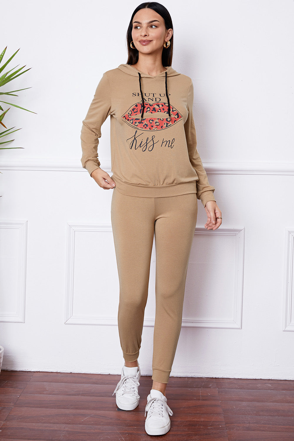 Khaki loungewear set with leopard print lips graphic and "Kiss me" text on hoodie.