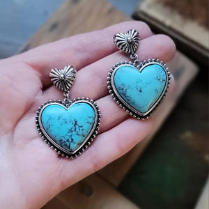 Turquoise heart stone drop earrings with beaded silver trim and sunburst studs.