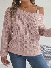 Blush pink one-shoulder knit sweater with buckle detail and waffle texture.