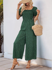 Dark Green smocked bodice jumpsuit with black leopard print, square neck, puff sleeves, and wide legs.