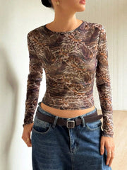 Sheer leopard print long-sleeve top in brown with a round neckline.
