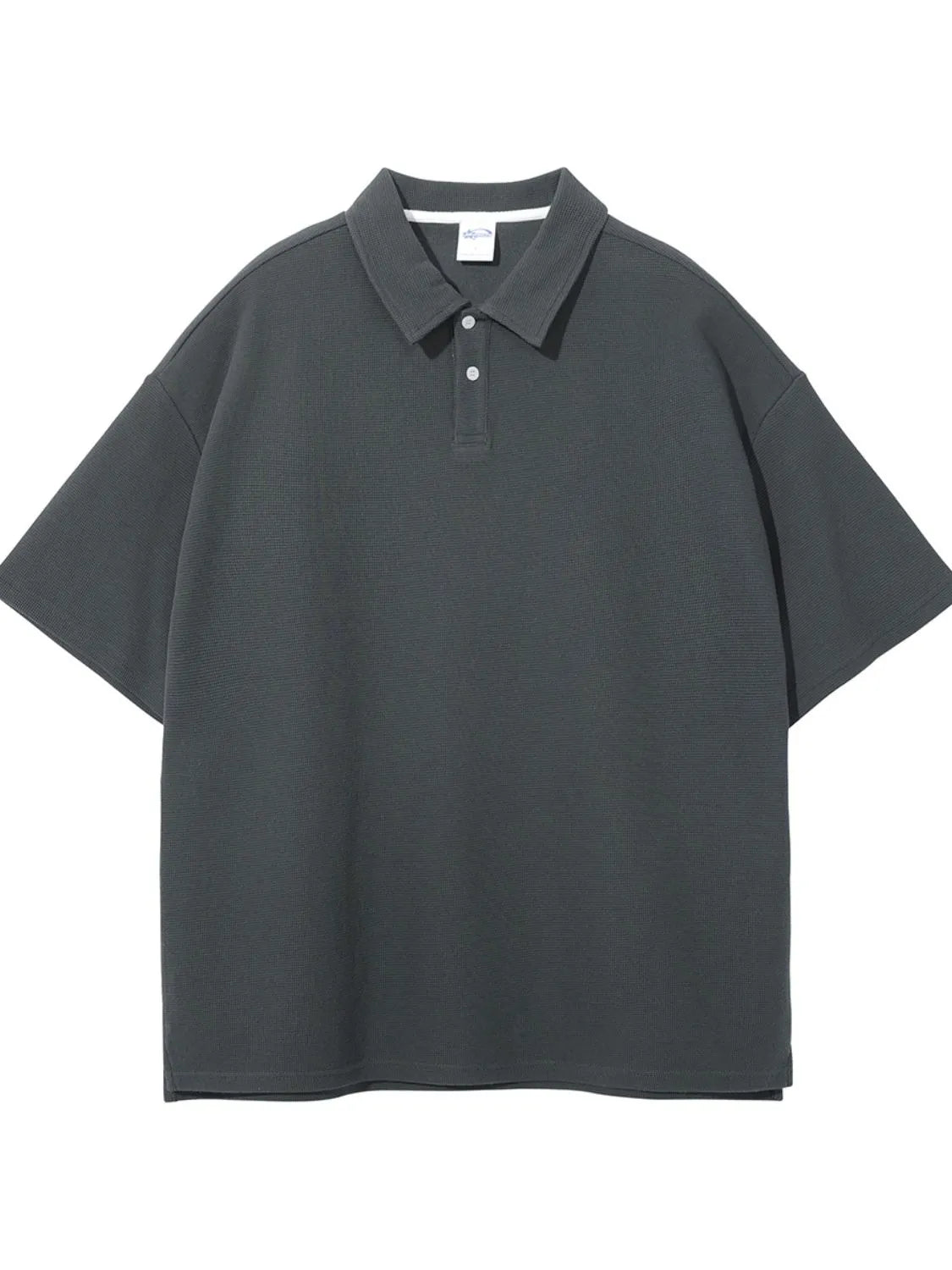 Boxy textured polo shirt in dark gray with a spread collar and two-button placket.