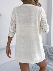 Ivory open-knit three-quarter sleeve cardigan with cable knit detail on sleeves.