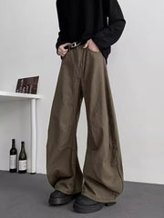 Earthy brown oversized men's sweatpants with pockets and a belt.
