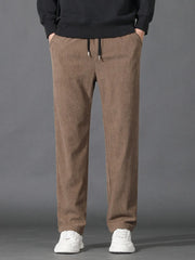 Khaki corduroy joggers with drawstring waist and pockets.