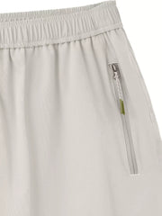 Light gray men's bermuda shorts with elastic waistband and zippered pocket detail.