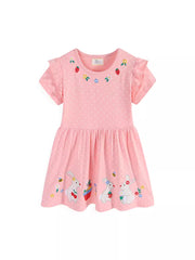 Pink polka dot cotton dress with embroidered bunnies, strawberries, and flowers. Ruffled sleeves.
