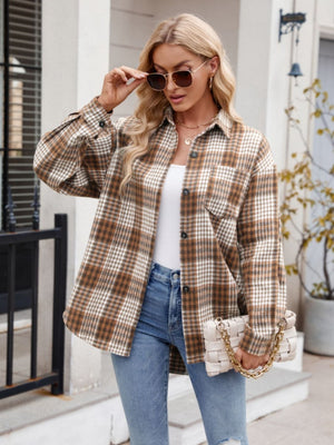 Oversized plaid shirt jacket in brown, white, and black with a pocket and button front.