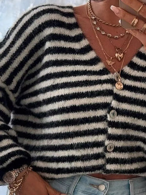 Black and white striped cropped knit cardigan with button front and fuzzy texture.