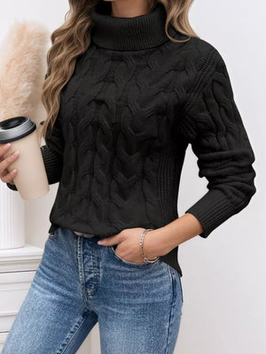 Black cable-knit turtleneck sweater with a cozy texture.
