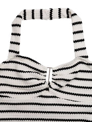 White and black striped knit halter mini dress with cutout detail.