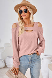 Blush pink geometric cutout shoulder long sleeve top with a square neckline.