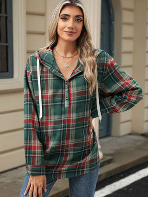 Plaid henley hooded shirt in green with red and tan plaid, featuring a buttoned placket and white drawstrings.