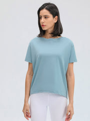 Dusty Blue relaxed fit performance tee with short sleeves and a boatneck.