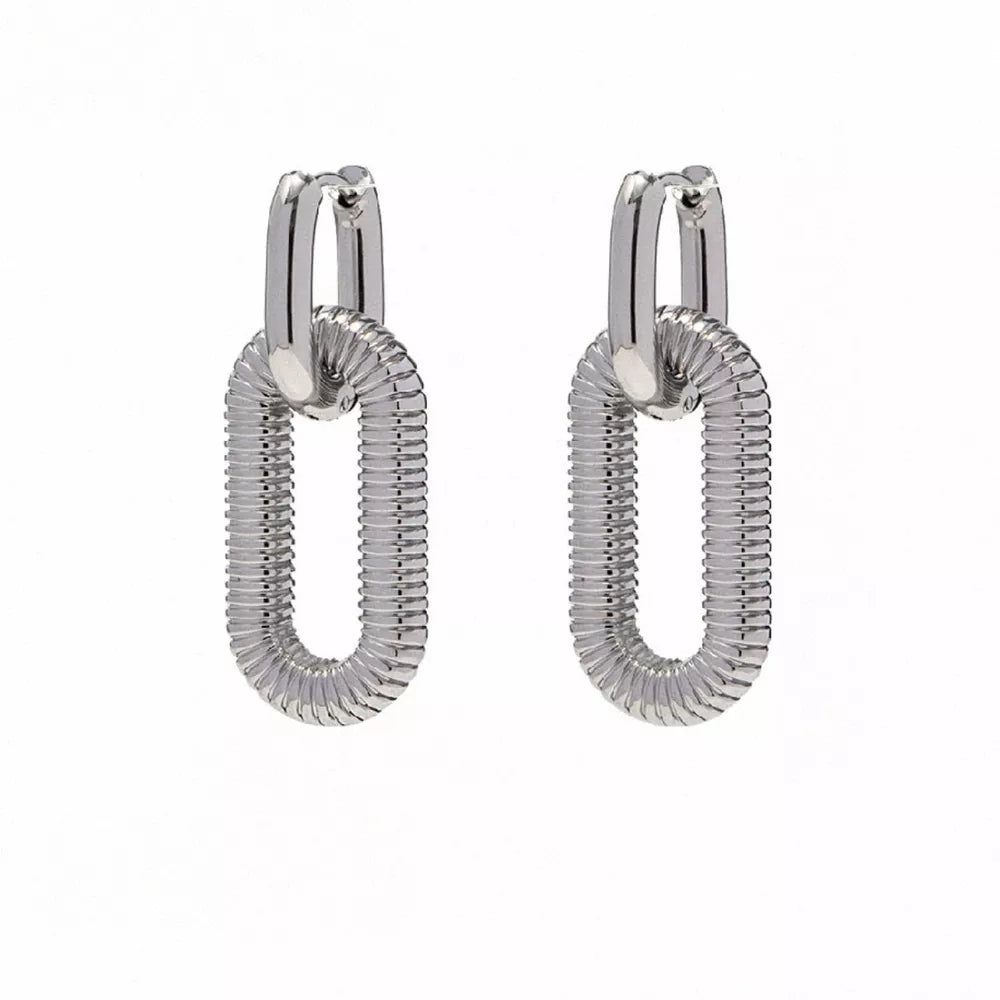 Sculptural silver link drop earrings with ribbed oval links.