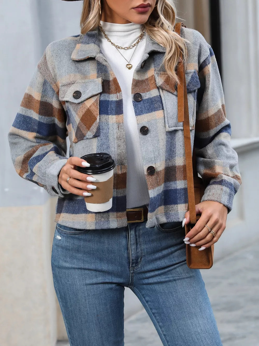 Plaid pocketed jacket with classic collar and button-down front, in a cropped length.