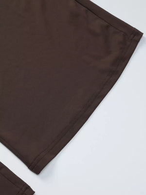 Brown halter crop top and wide-leg pants set detail showing stitching.