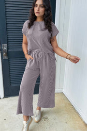 Gray ribbed knit drawstring co-ord set with short sleeves and wide-leg pants.