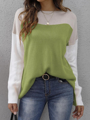 Colorblock crewneck knit sweater in lime green, beige, and white with side slits.