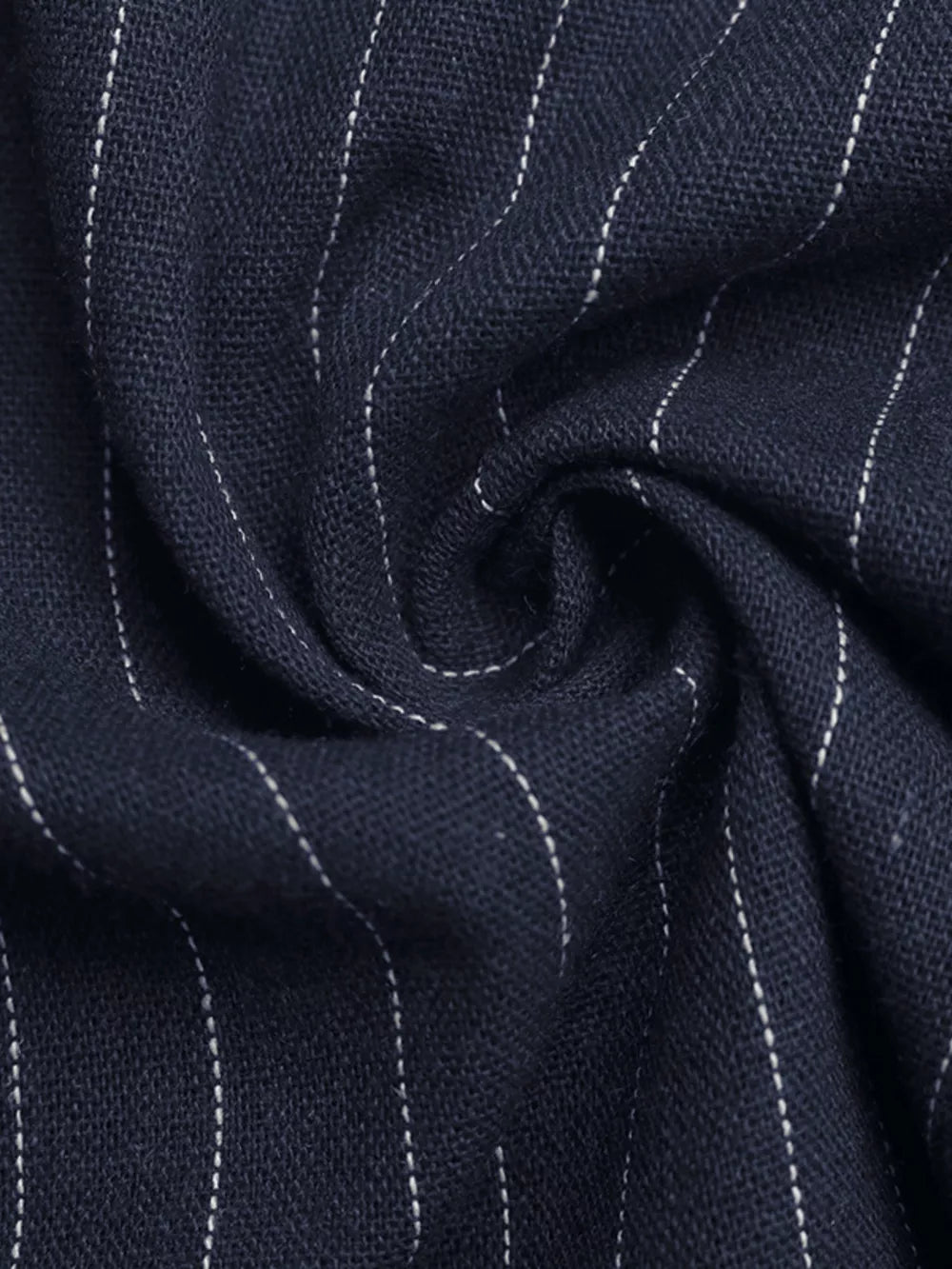 Navy cotton jumpsuit with white pinstripes and decorative buttons.