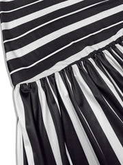 Plus size black and white striped maxi dress with elasticated waist and flowing skirt.