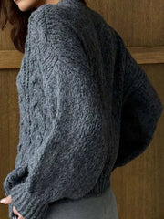 Gray cable-knit button-down cardigan with textured knit and ribbed cuffs.