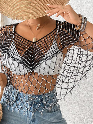 Black crochet cardigan with silver beads and fringe detail, V-neck, open knit.