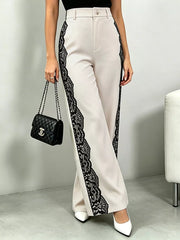 Maternity pants with high waist and lace trim down the sides.