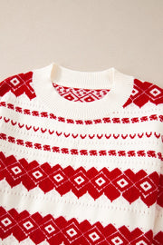 White crewneck pullover sweater with red Fair Isle pattern and ribbed neckline.