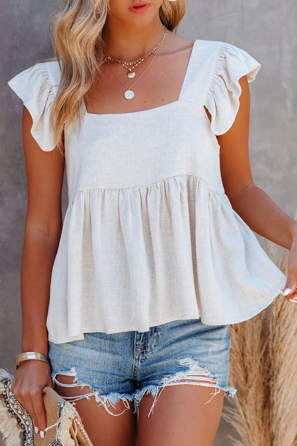 White babydoll linen top with flutter sleeves and square neckline