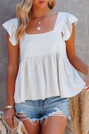 White babydoll linen top with flutter sleeves and square neckline