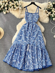 Blue and white tiered cami maxi dress with lace trim and cutout detail.