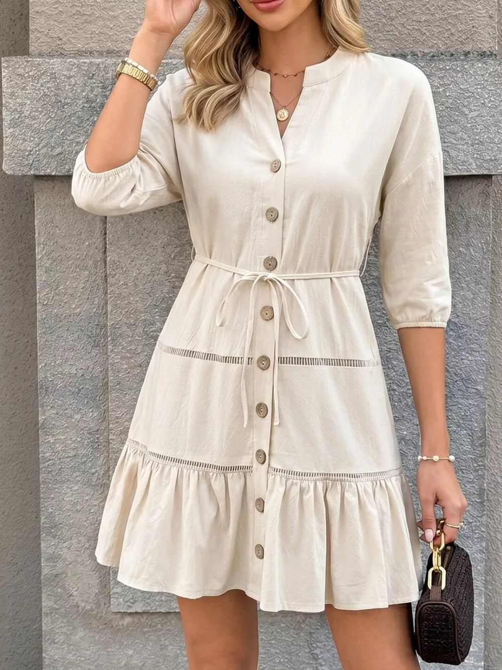 Apricot cotton V-neck buttoned mini dress with ruffle hem and tie waist.