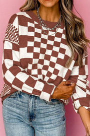 Geometric knit pullover sweater in mocha and white checkerboard pattern with crew neck.