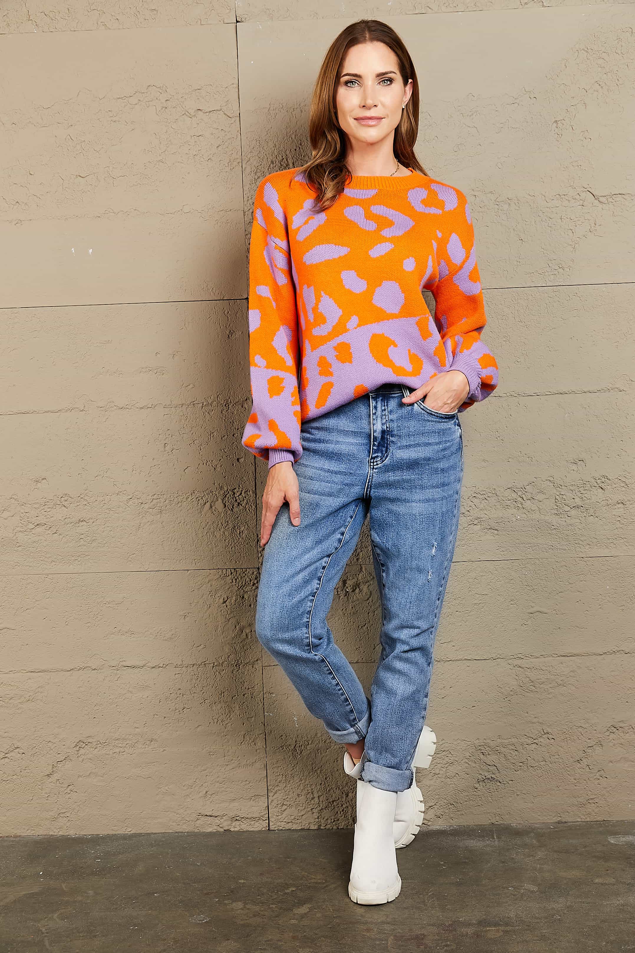 Orange-red and purple leopard print acrylic sweater with balloon sleeves and crew neck.