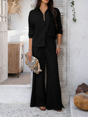 Black split-front palazzo pants and button-down shirt set with adjustable waist