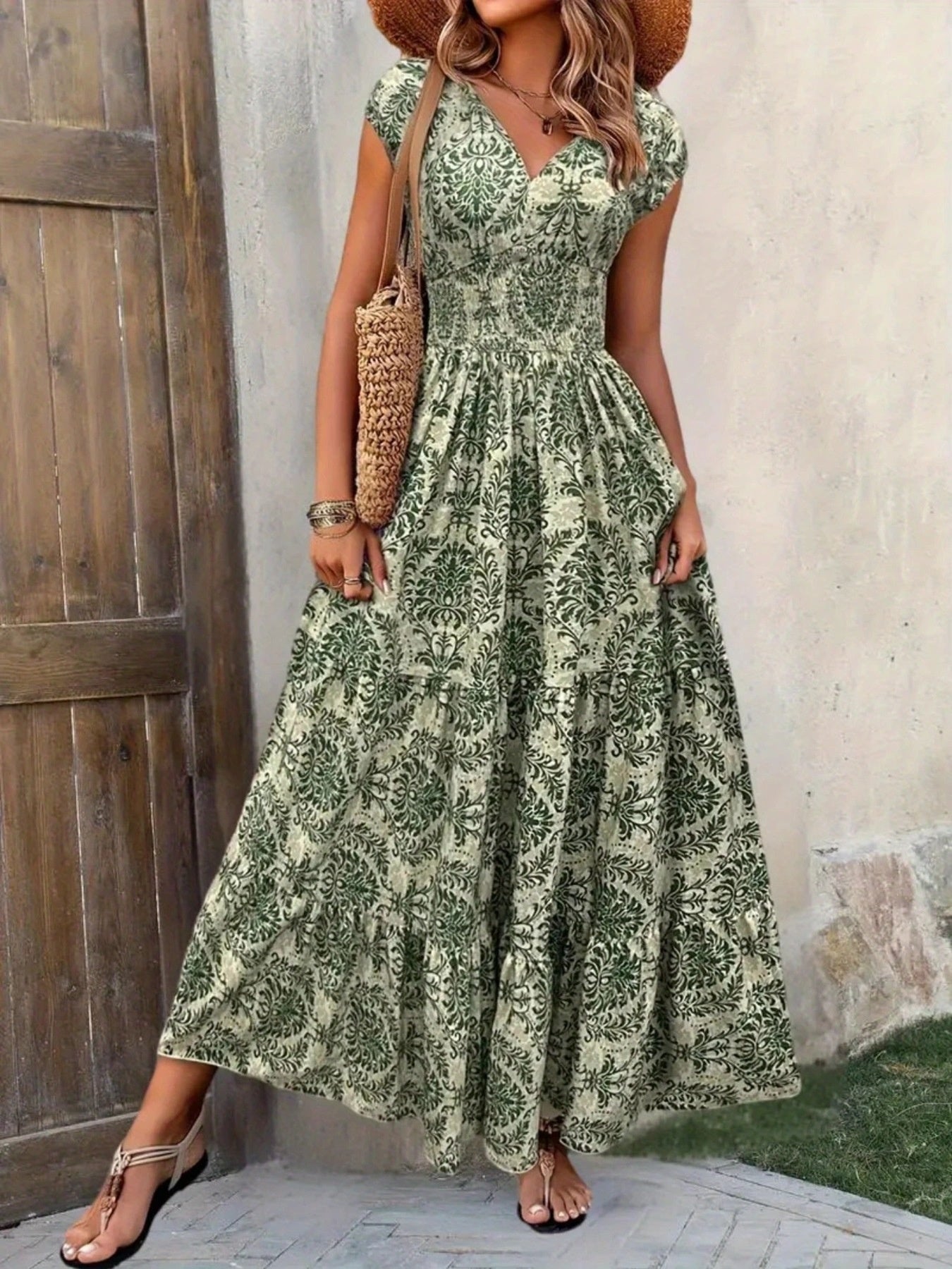 Green damask print cap sleeve maxi dress with smocked waist and tiered skirt.