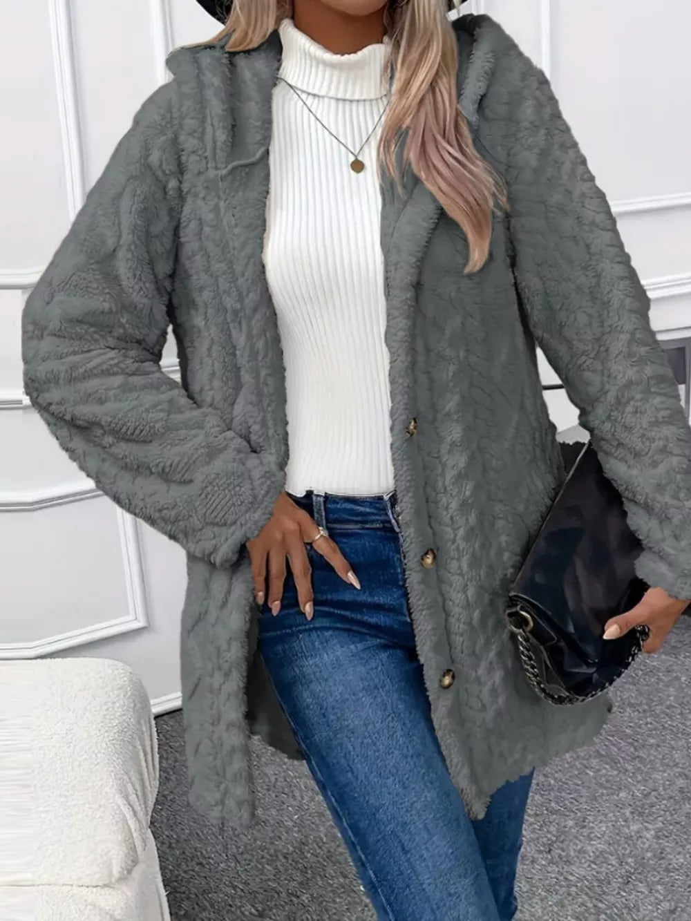 Gray hooded teddy coat with button detail and textured fabric.