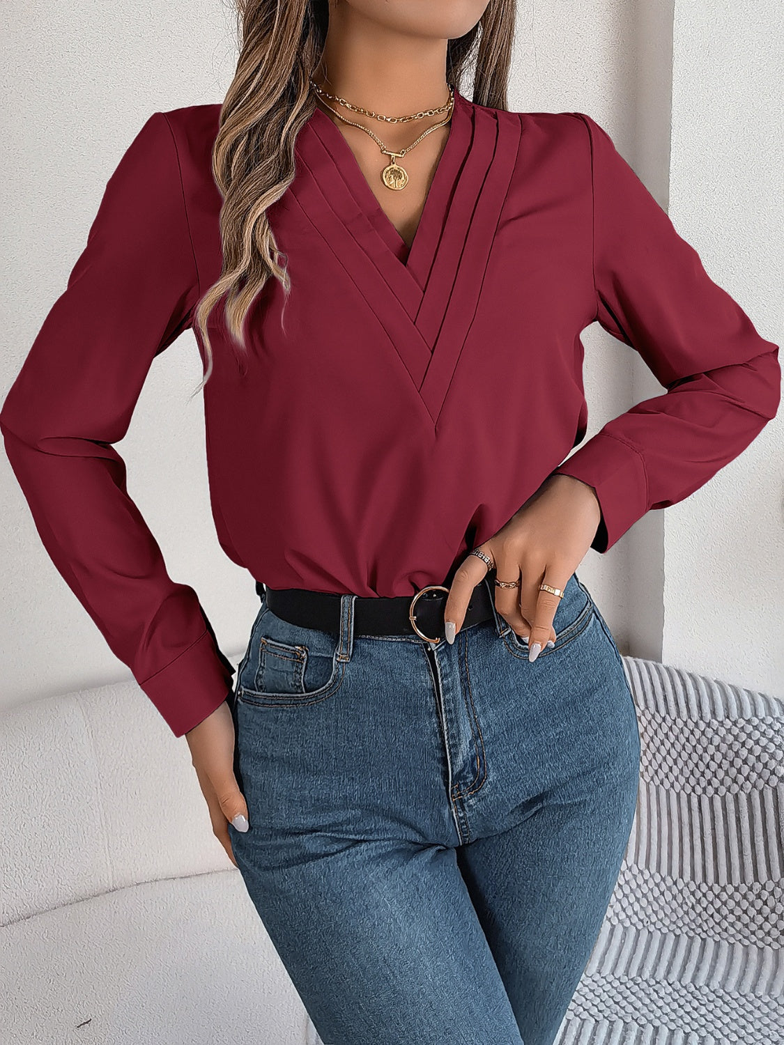 Burgundy pleated V-neckline long sleeve blouse