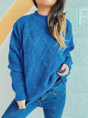 Blue sparkle knit relaxed fit sweater with mock neck and cable knit detail.