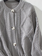 Gray cable-knit button-down cardigan with diamond and cable textures.