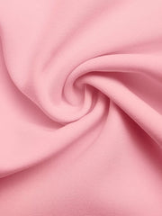 Pink fabric detail with soft folds and subtle texture.