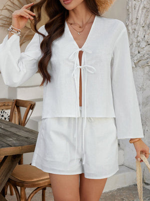 White linen tie-front top and shorts set with bell sleeves and drawstring waist.
